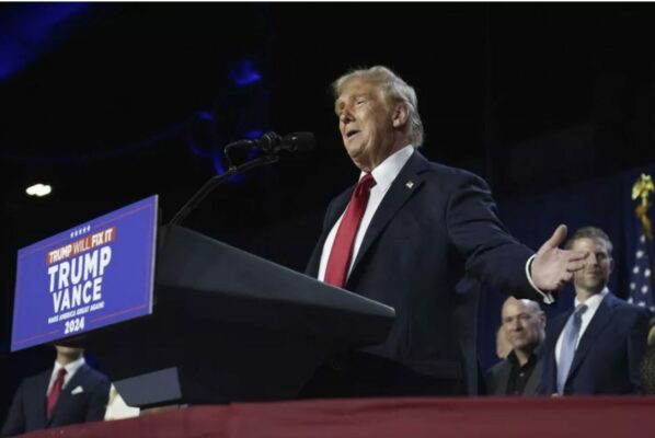  Trump delivering his acceptance speech at Liberty Plaza, addressing a cheering crowd.