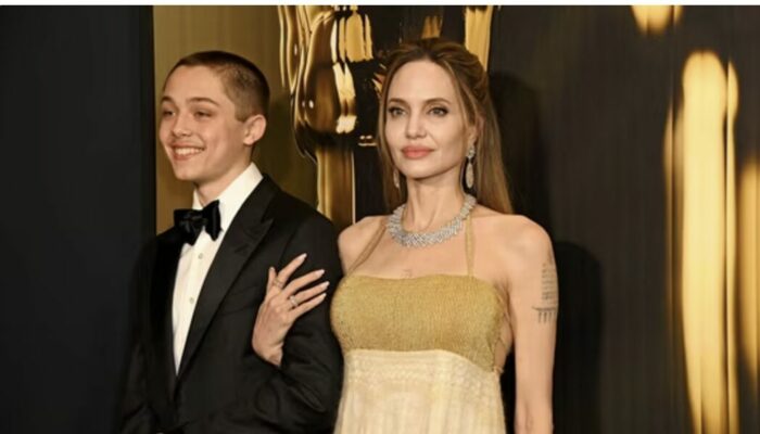 Knox Jolie-Pitt attending the Governors Awards in a sleek black suit, sparking speculation online with the question Is Knox Transgender?