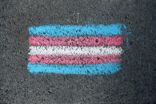 Transgender Day of Remembrance event where names of transgender individuals are read aloud.