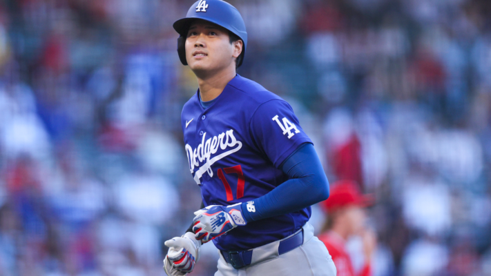 Fans watch an intense Major League Baseball game during the 2026 season as the stadium atmosphere builds around the live action.