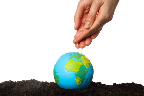 Earth Day 2026 volunteers join a community clean-up and plant trees for the planet.