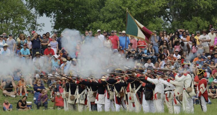 San Jacinto Day 2026 reenactment showing soldiers and battlefield action in Texas