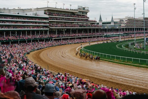United States Kentucky Oaks Day 2026 features crowds in pink outfits at Churchill Downs.